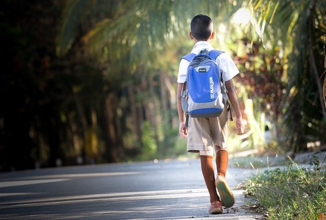 boy wearing a back pack